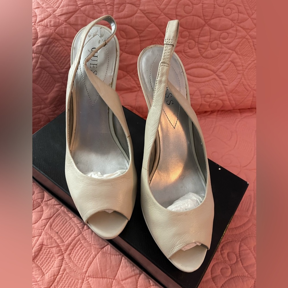 Cream color Guess platform sling back shoes.
